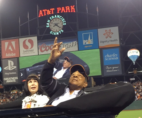 Willie Mays tossing a baseball